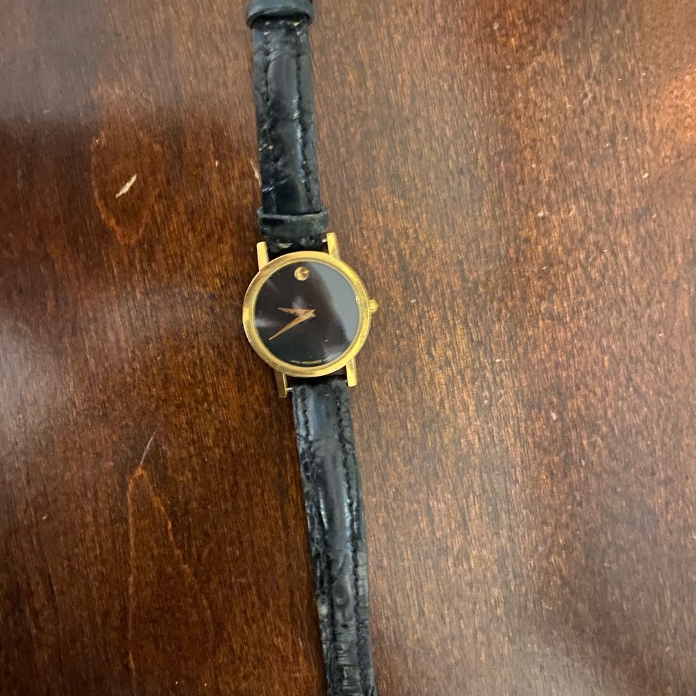 Women’s black face Movado watch.